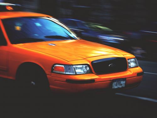 A photo of a taxi speeding along